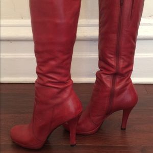 Red/burgundy knee high, high heel leather boots